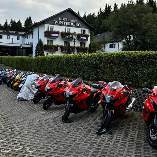 Row of motorcycles in front of the hotel