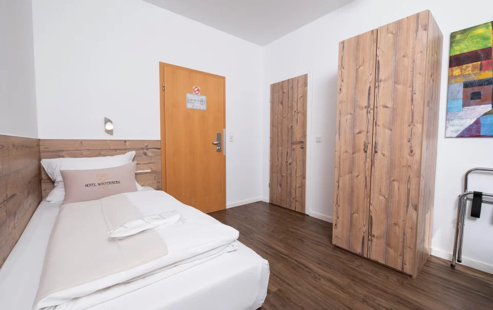 Single bed with a wooden headboard