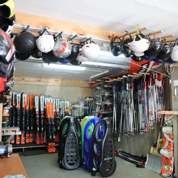 Ski equipment and helmets displayed for rental