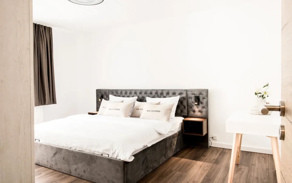 Double bed with an upholstered headboard