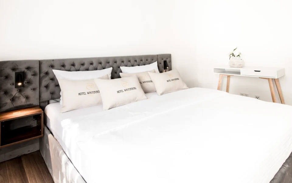 Double bed with an upholstered headboard