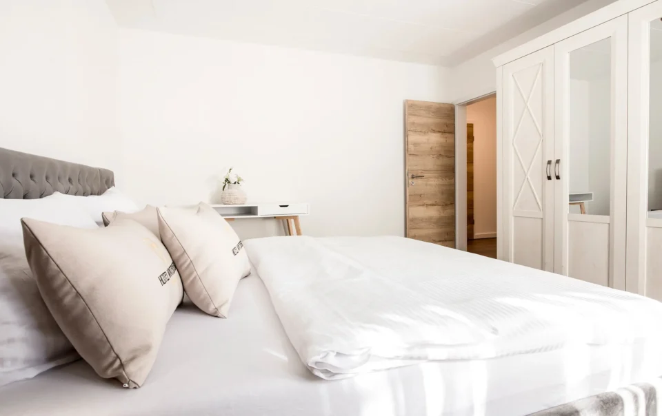 Double bed with an upholstered headboard