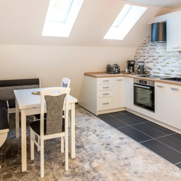 Fitted kitchen beneath skylights