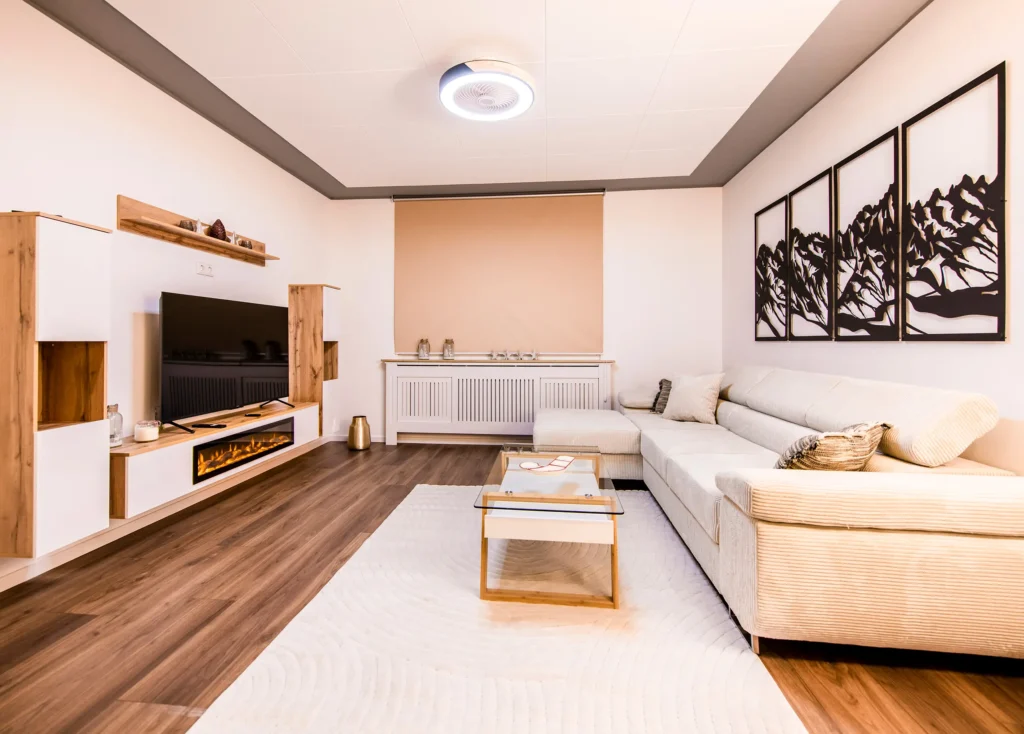 Suite seating area with pale sofas and a coffee table