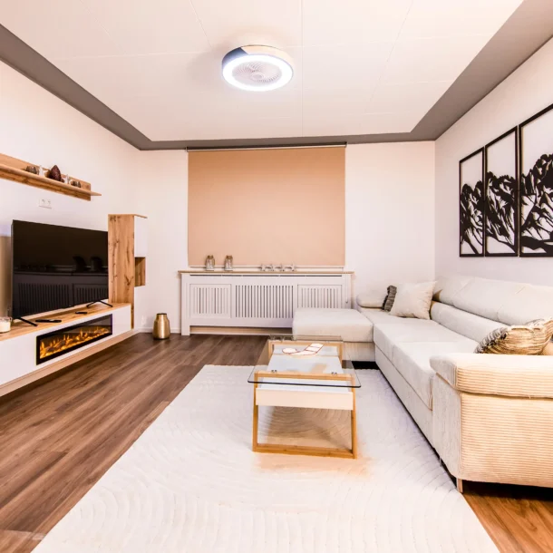 Suite seating area with pale sofas and a coffee table
