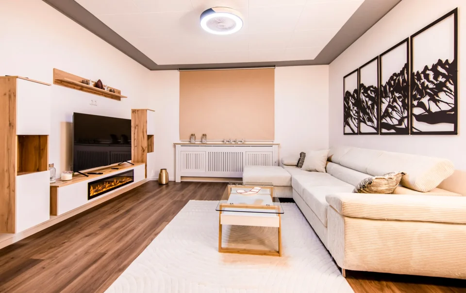 Suite seating area with pale sofas and a coffee table