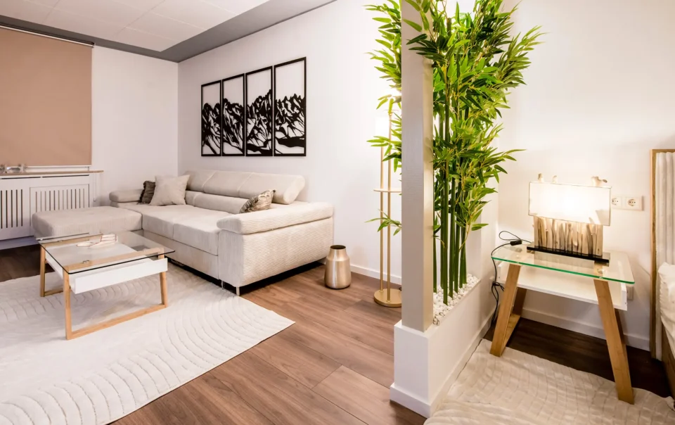 Suite seating area with pale sofas and a coffee table