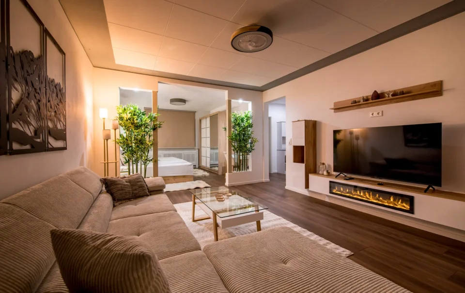 Suite living area with sofa, coffee table and large windows