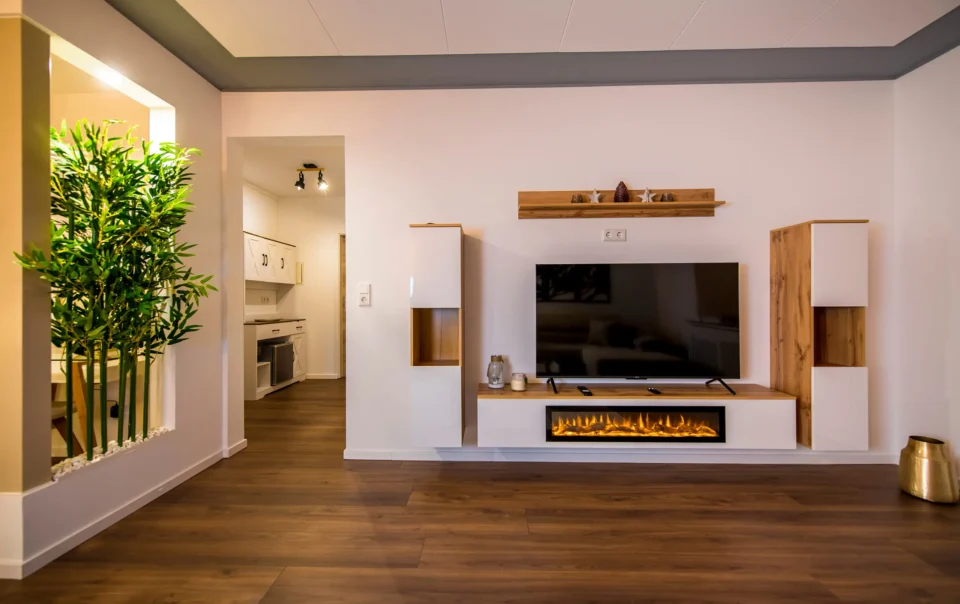 Television above a fireplace in the suite