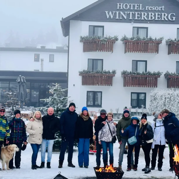 Group posing together outside the hotel