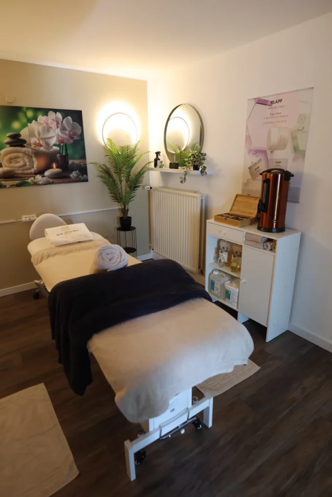 Spa treatment room with a reclining treatment bed and KLAPP products at Hotel Winterberg Resort
